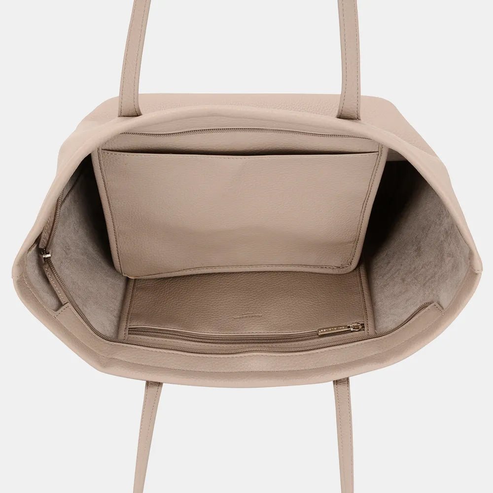 Close-up of quality leather texture on minimalist tote bag