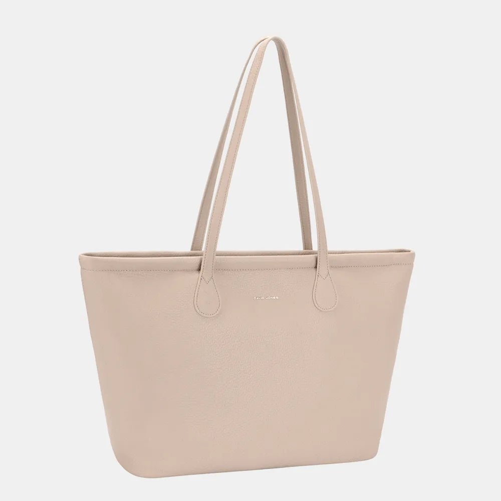 Interior of minimalist leather tote bag with pockets and compartments